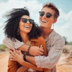 couple smiling with summer ready smiles