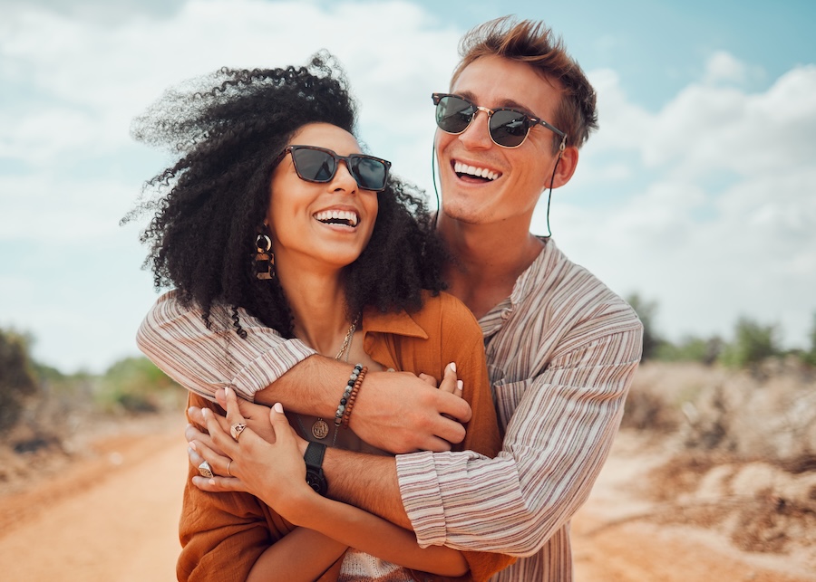 couple smiling with summer ready smiles