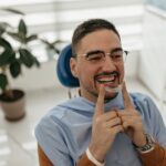 man wearing invisalign tray to help to not forget to wear your invisalign