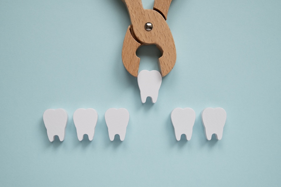 wooden teeth showing tooth extraction, preparing for oral surgery